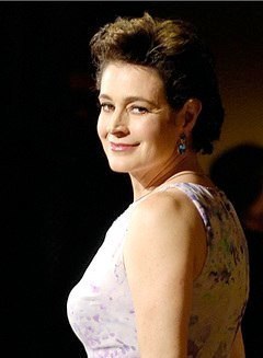 Sean Young, casual portrait against barn wood