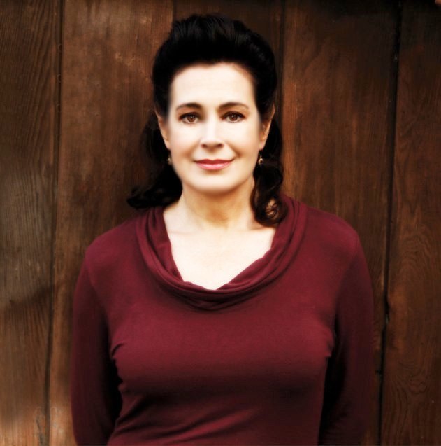 Sean Young outside a café between takes