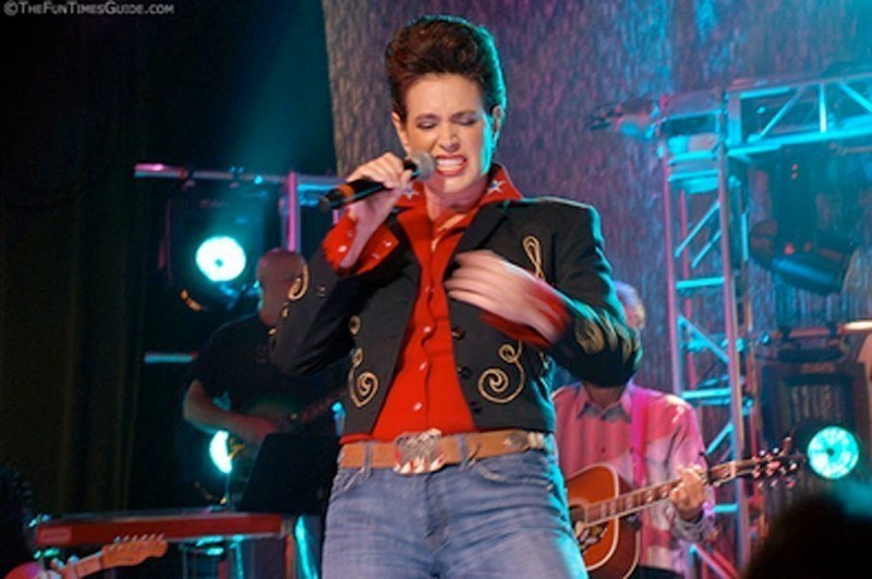 Sean Young singing on stage on Gone Country