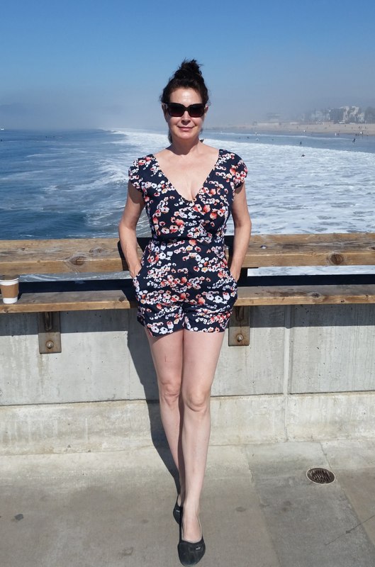 Sean Young photographed on a boardwalk by the sea